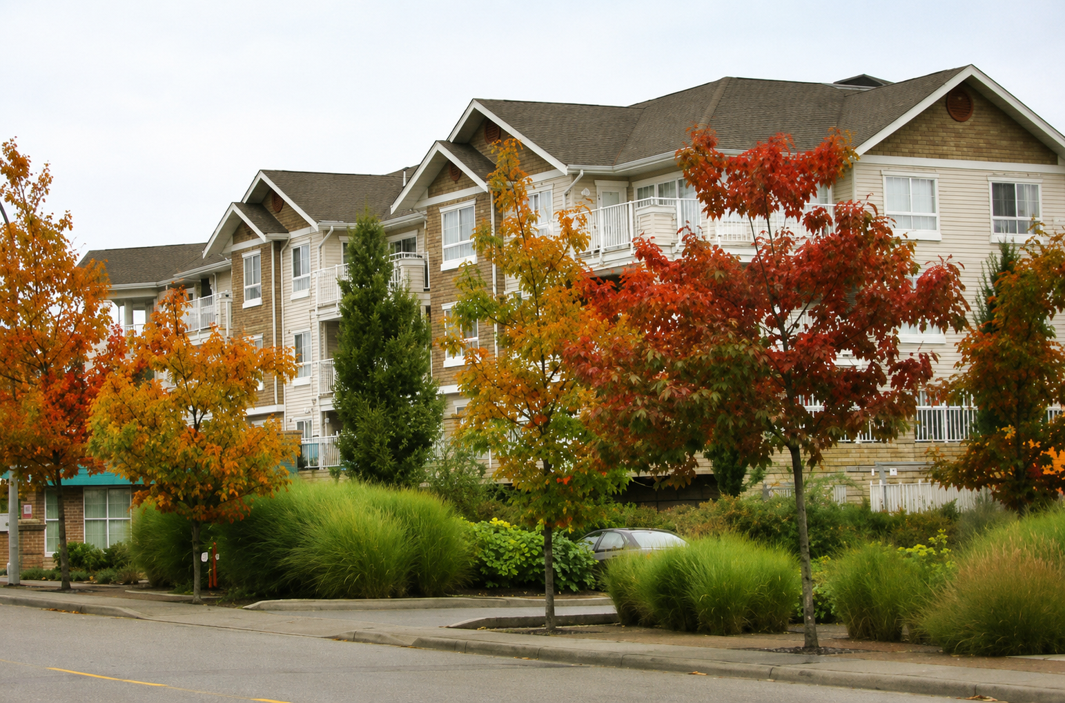 Multi-residential building in autumn — representative of ITEC's residential and mixed-use project portfolio.